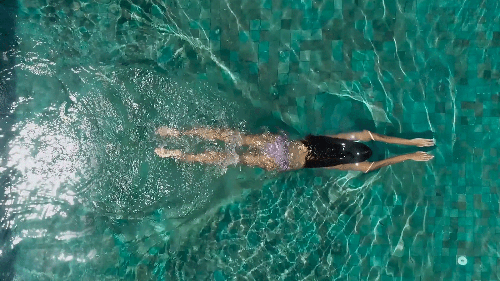 Residents enjoying luxury swimming pool amenities at Riverdale Township, Kharadi Pune — premium leisure lifestyle.